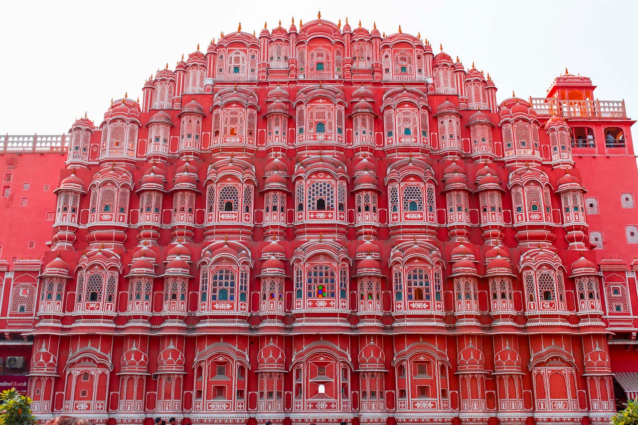who-we-are Explore the intricate facade of Hawa Mahal in Jaipur, showcasing its stunning pink architecture and cultural significance.
