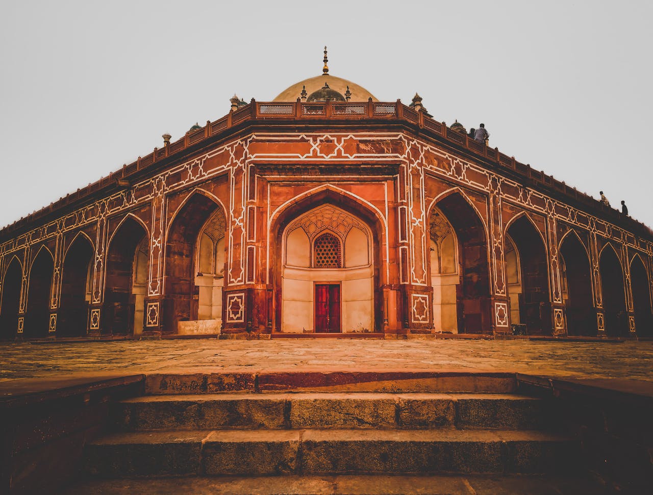 about-us Stunning view of Humayun's Tomb with intricate Mughal architecture in daylight, Delhi.